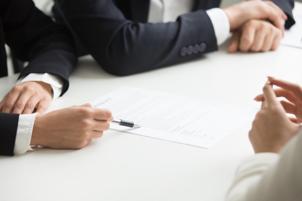 Lawyers reviewing a contract during litigation